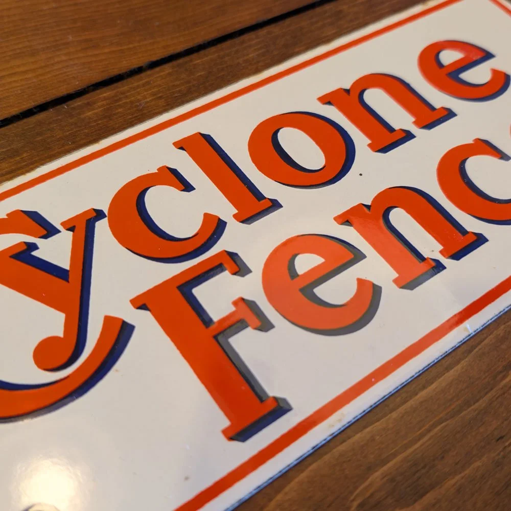 Cyclone Fence Sign — Aurora Mills